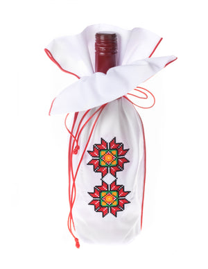 A uniquely embroidered flower design highlights the front of this Christmas wine gift bag.   Place your favorite wine inside and present to a friend.
